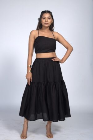 Women Sleek Black Co-Ord Set With An Asymmetrical Strap And Flowy Midi Skirt